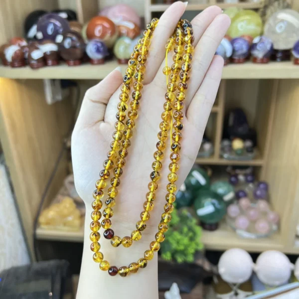 Chuỗi Đeo Tay Hổ Phách Vàng 108 Hạt